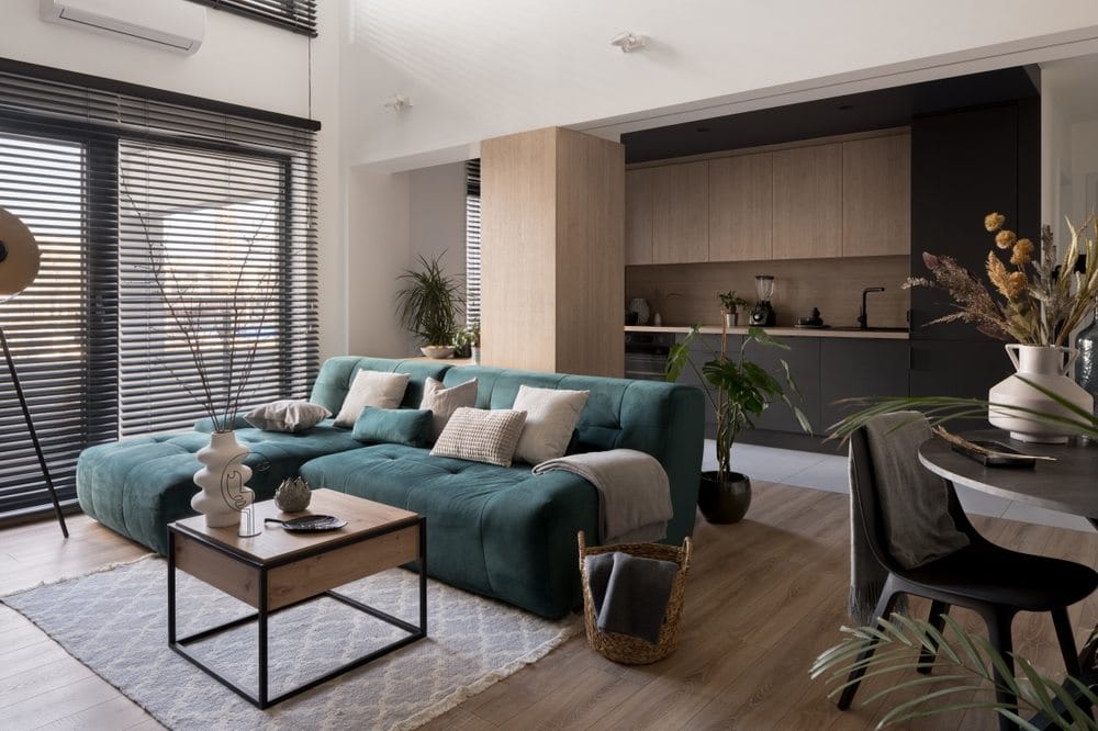 teal L-shaped modular couch with a side table