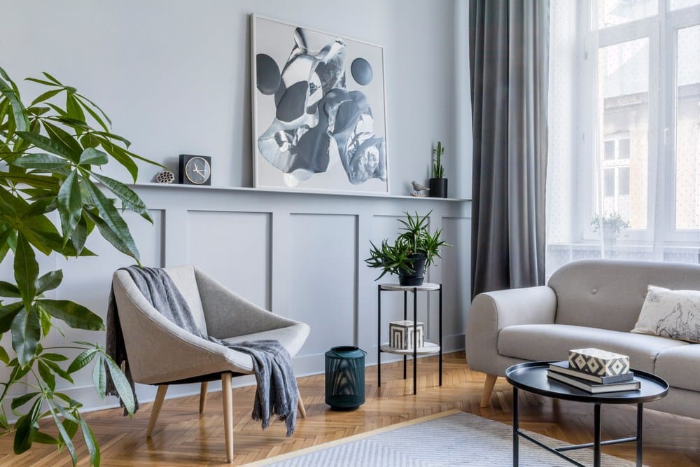 scandinavian style living room with half wall paneling