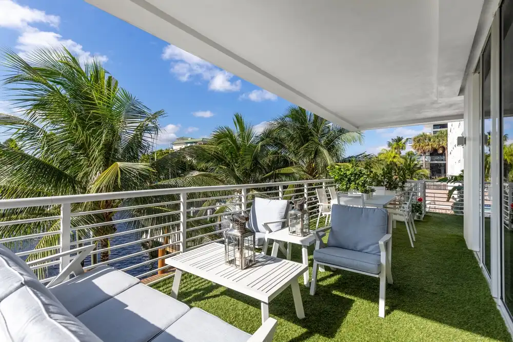 Balcony with artificial turf and seating areas