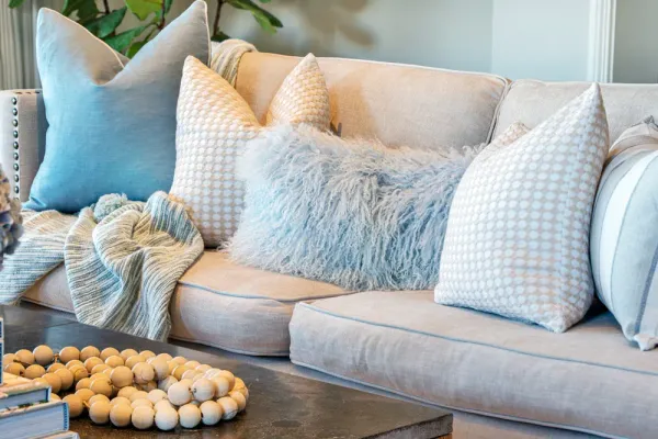 couch with coastal style pillows and decor